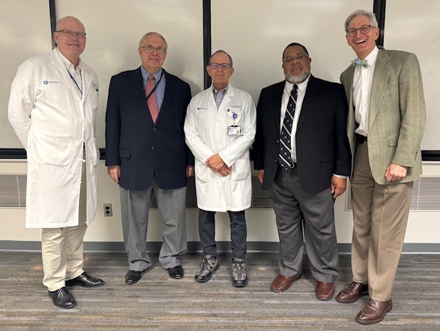 Jeff Gingrich (1994 graduate), Phil Walther (Duke Medical School graduate), Cary Robertson (1986 graduate), Nat Barnes, and John Wiener (1995 graduate) at Grand Rounds.