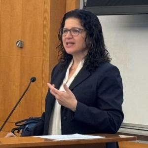 Rosalia Misser, MD, at lecturn
